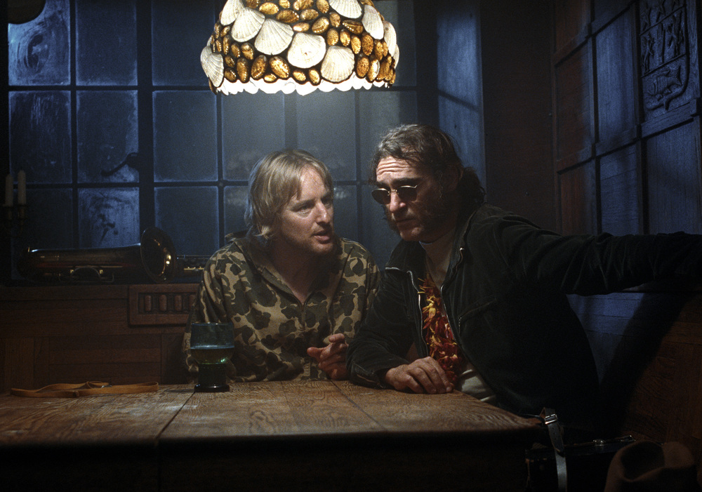 Owen Wilson and Joaquin Phoenix shamble through the dense web of intrigue in  Inherent Vice.