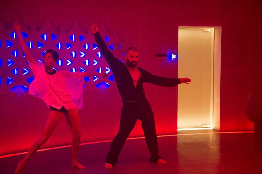 Sonoyo Mizuno and Oscar Isaac get their groove on in the mad scientist's underground layer in  ex_machina .
