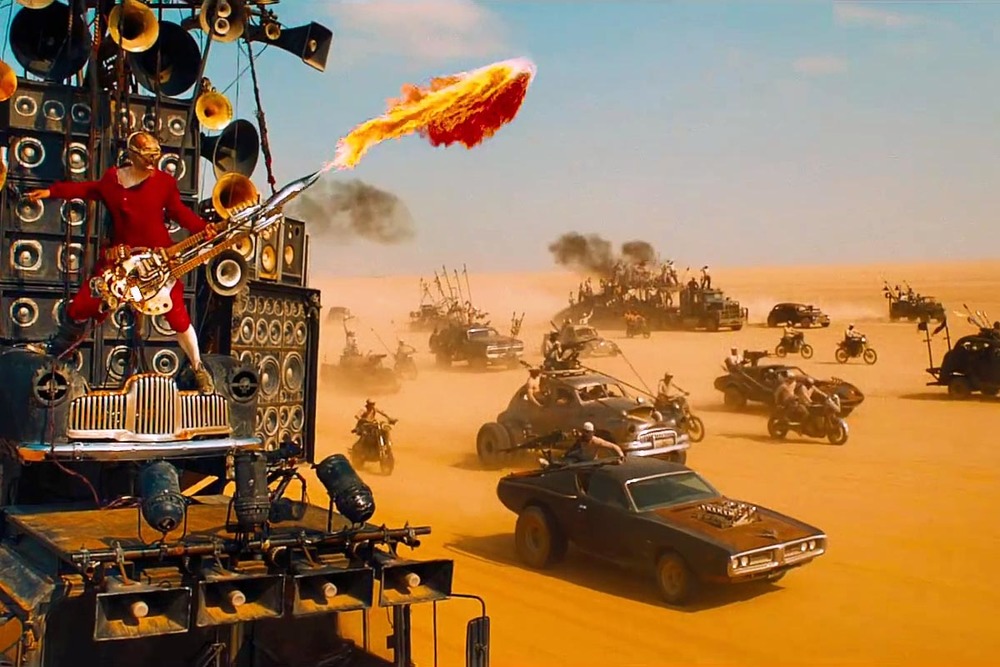 iOTA plays The Doof Warrior,&nbsp;the most   m/ METAL m/   character in the year's most   m/ METAL m/   film,  Mad Max: Fury Road.